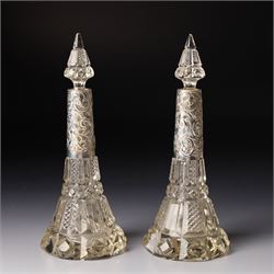 Silver upright photograph frame, aperture size 14cm x 9.5cm Birmingham 1919, pair of glass scent flasks with silver collars H16cm , two others, two dressing table jars with silver covers and a silver candlesticks