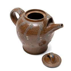 Gus Mableson - two studio pottery teapots, the larger example with a repeating floral pattern upon a brown ground, each with impressed makers marks below the handle, largest H18cm