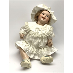 SFBJ 'Laughing Jumeau' bisque head doll with applied hair, sleeping brown eyes, open-closed mouth with teeth and tongue and composition body with jointed limbs, impressed marks 'SFBJ 236 Paris 12', H60cm    