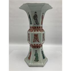 Chinese Kangxi gu vase, of hexagonal form with fluted rim, decorated in polychrome enamels with a male figure to each panel and red character marks to centre, with painted red leaf mark beneath, H32.5cm