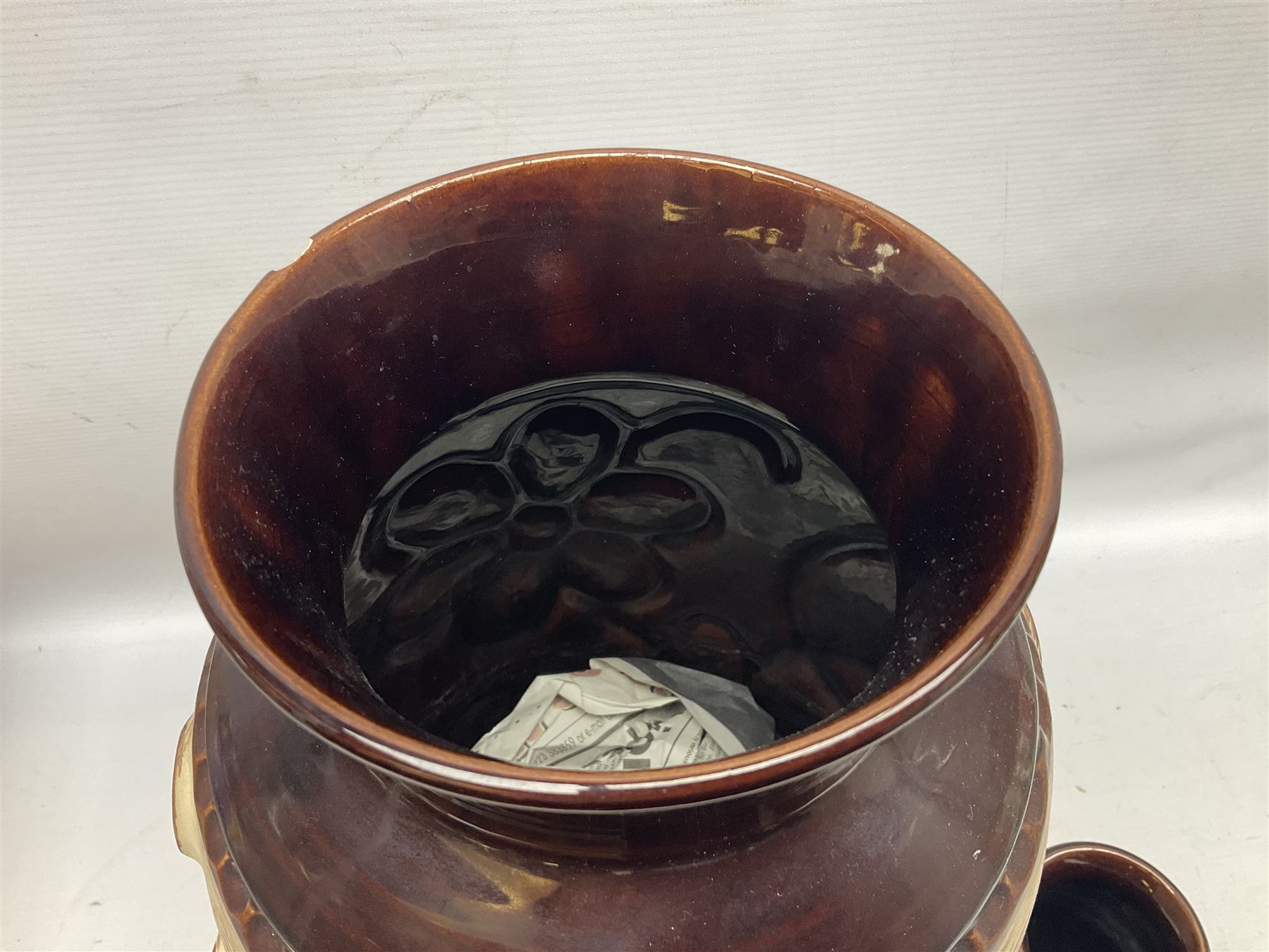 Pair of Bay West German vases, with bold moulded flower and foliage decoration in green, orange and ochre on brown ground, largest H40cm