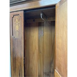Edwardian inlaid mahogany wardrobe, projecting cornice above, single cupboard door with oval bevel edge mirror above single long drawer, raised on plinth base (W101cm, D47cm, H194cm), together with matching dressing table, (W92cm, D50cm, H150cm)