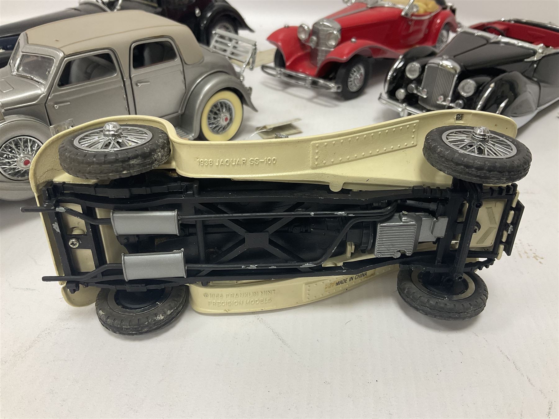 Franklin Mint - five 1:24 scale die-cast precision models comprising 1930 Bugatti Royale Coupe Napoleon, 1933 Duesenberg SJ Twenty Grand, 1935 Mercedes Benz 500K Special Roadster, 1938 Jaguar SS-100, and 1947 Bentley 