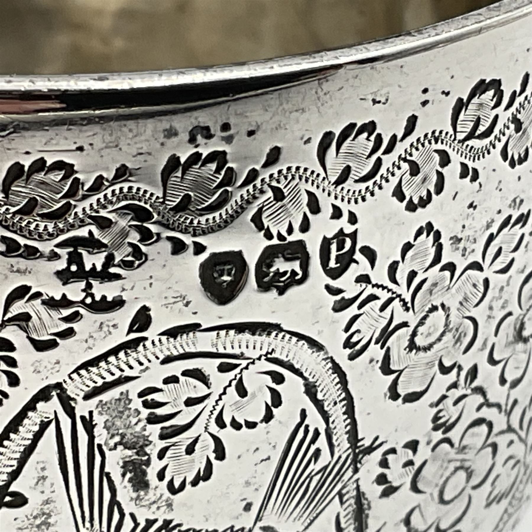 Late Victorian silver bachelors three piece tea service, comprising bullet shaped teapot, open sucrier and milk jug, each engraved with monogram surrounded by birds upon and amidst a blossoming vine, the teapot with scroll capped curved wooden handle and wooden finial to cover, hallmarked Wakely & Wheeler, London 1890, teapot including handle H12cm, sucrier H5.5cm 