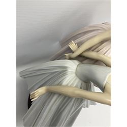 Lladro figure group, 'Merry Ballet', modelled as two ballerinas in dancing pose, raised on a turned socle base, no. 5035, printed marks beneath, H49cm