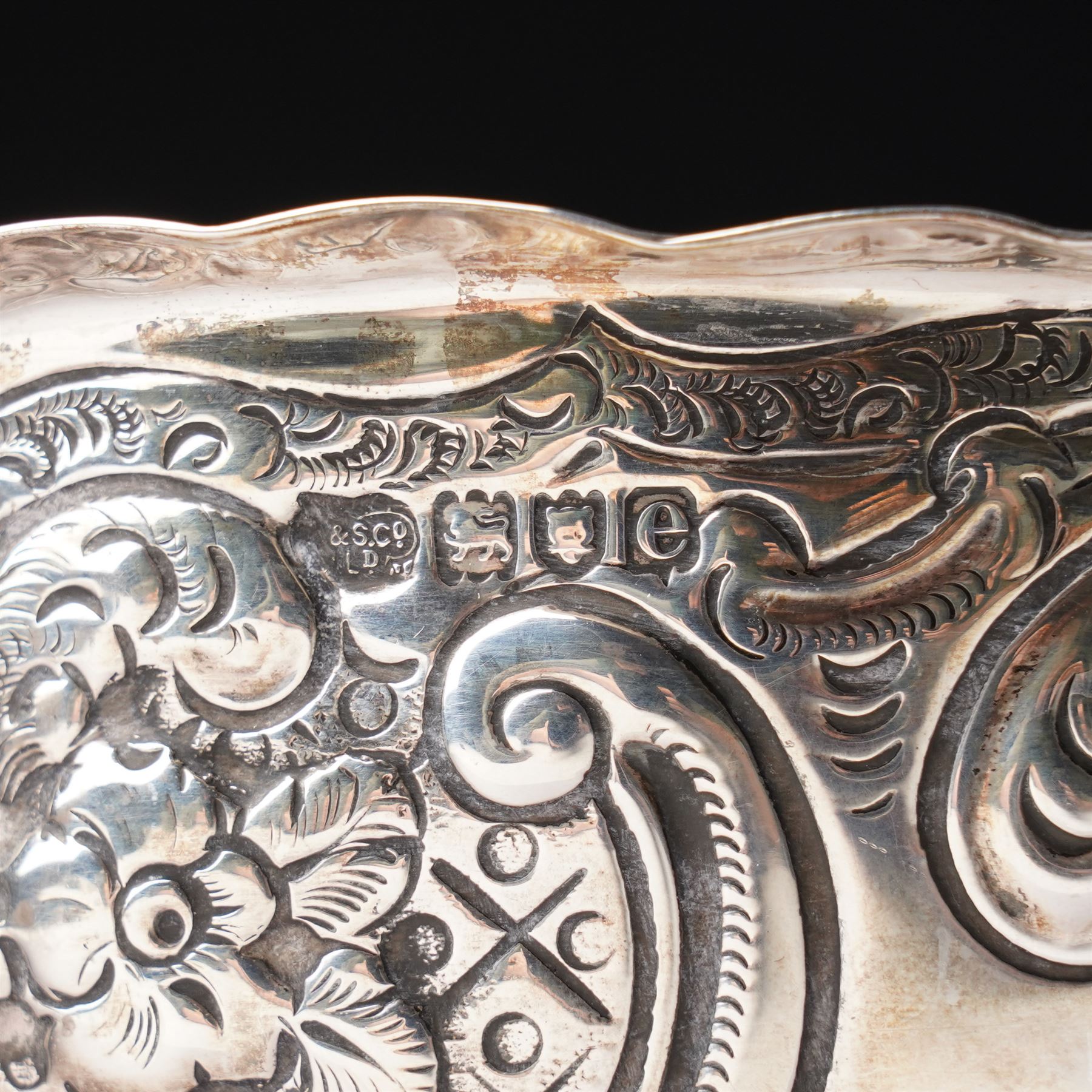 Late Victorian silver bowl embossed with flower heads and scrolls and with vacant cartouches on short pedestal foot D17cm London 1900 Maker Goldsmiths & Silversmiths Company