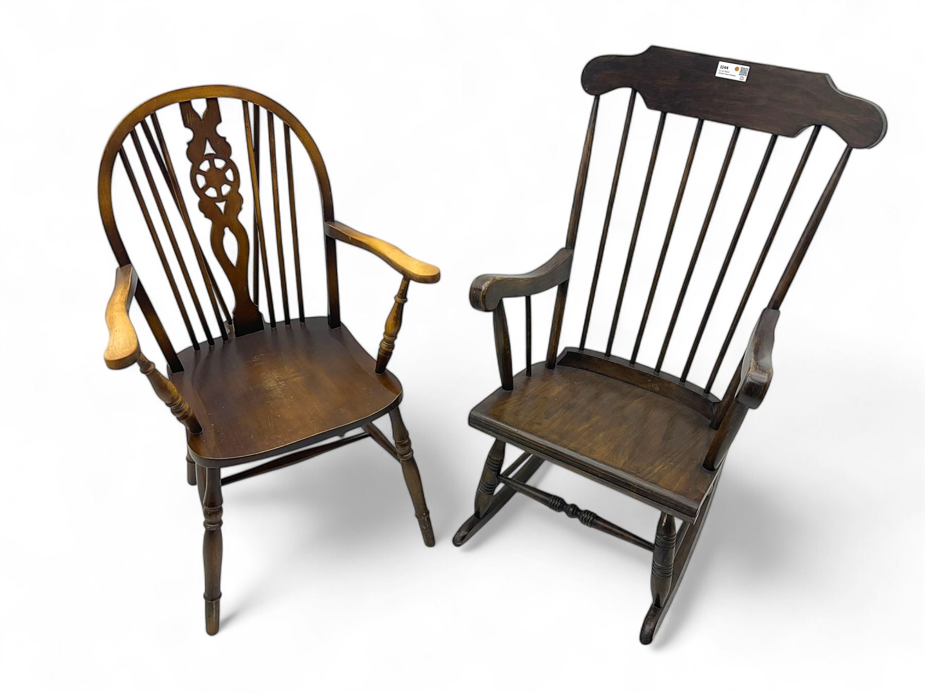 Early 20th century Windsor design rocking chair, shaped cresting rail over a spindle back, curved arms and plain seat, raised on turned supports with curved rockers; mahogany wheelback armchair raised on turned supports with H-stretcher 
