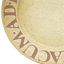 David Lloyd Jones (1928-1994): large studio pottery charger, the 'Eboracum' script in brown against a light green ground with brown speckles, impressed mark to base, D47cm 