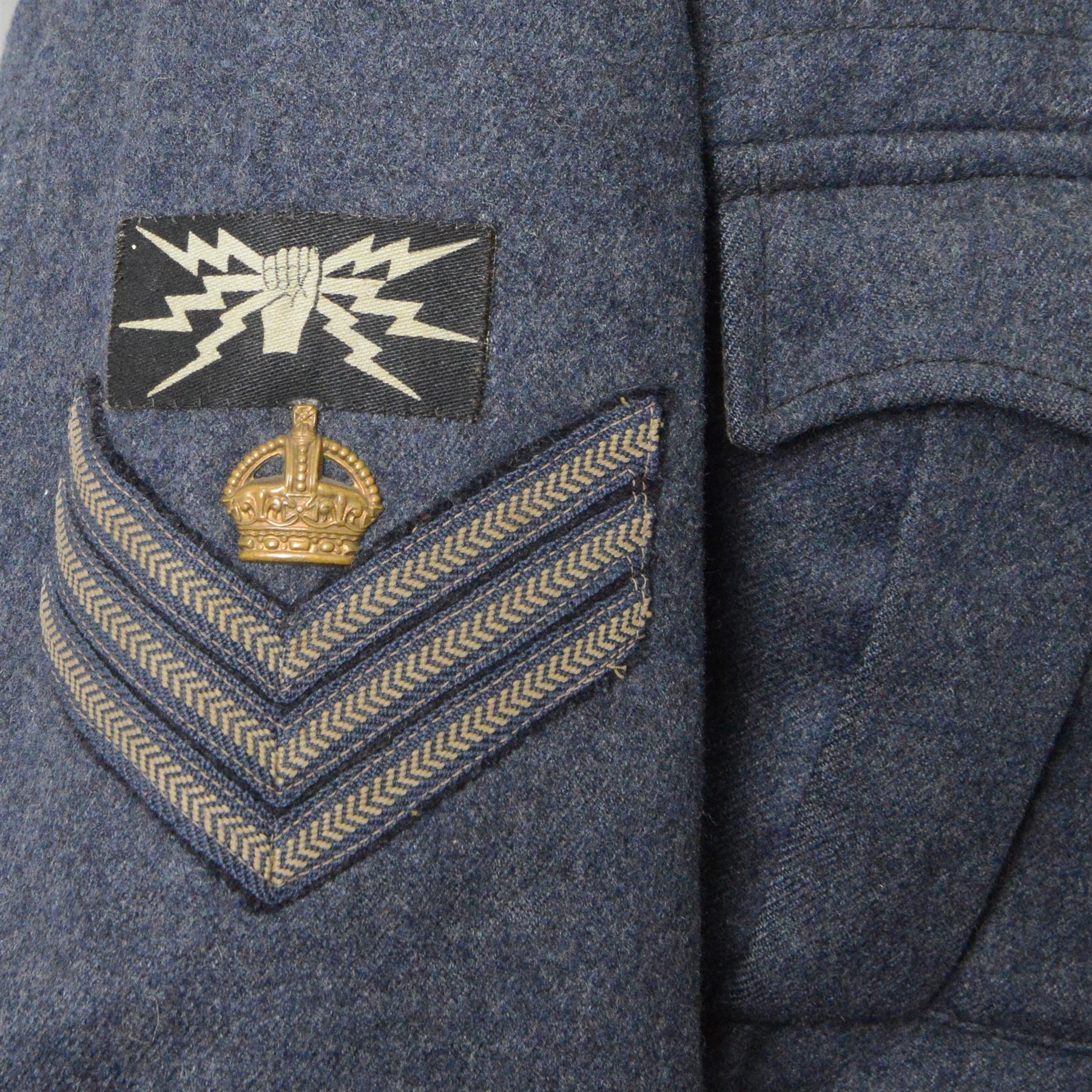 WWII Royal Air Force battle dress blouse, belonging to Flight Sargent Colin Scott 3011422, dated 1945, tailors label for M & N Horne Ltd 1945, Size No 7, blue cloth, Signaller cloth brevet, wireless officers patch to right sleeve and braid sergeant stripes to both sleeves, together with his flight log book, postings & Movements, Royal Air Force Service and Release Book, photographs etc  