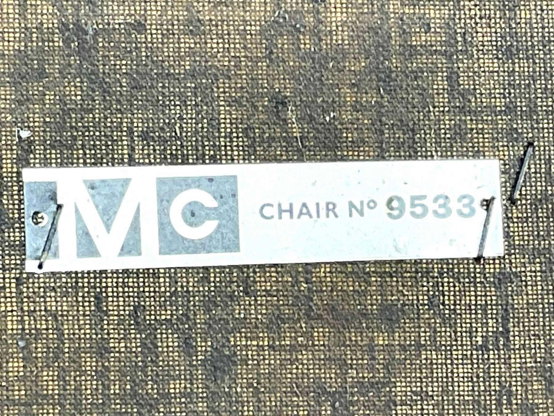 Mid-20th century teak extending dining table, circular top with pull-out extension and concealed leaf extension mechanism, on tapered supports; set of four teak dining chairs with black vinyl padded seats 