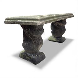 Weathered cast-stone garden bench with squirrel designed supports and rectangular top