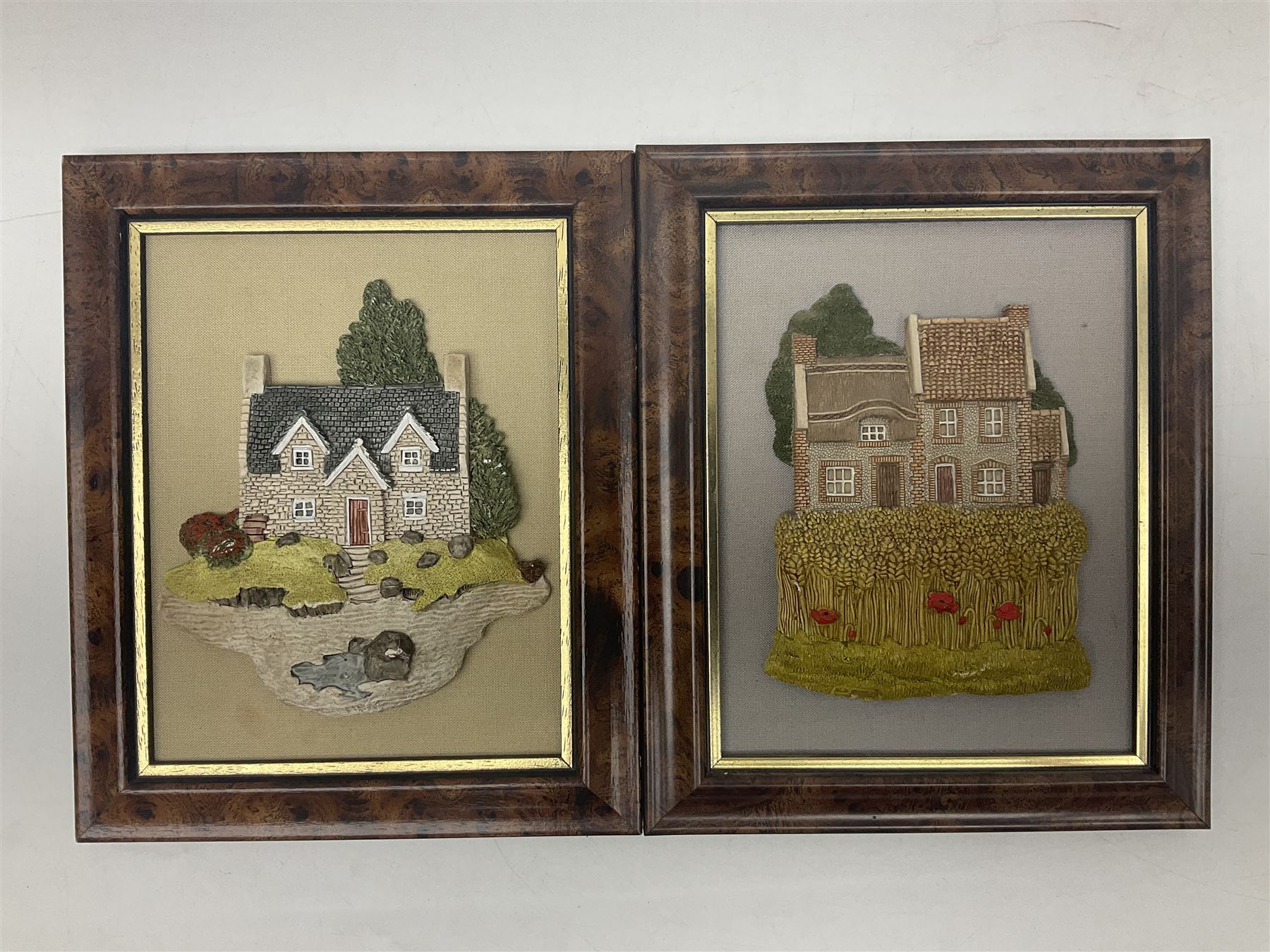 Nine Lilliput Lane framed wall plaques, including Fell View, Battleview, Catslide Cottage, Ashdown Hall and Shannon's Bank, together with three smaller circular framed Lilliput Lane plaques
