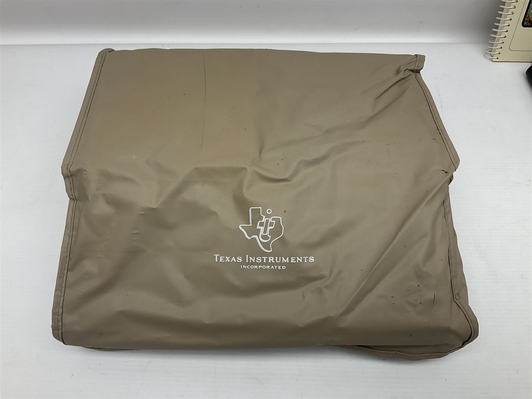 Four 1970s Sinclair electronic calculators - Cambridge in hard case with booklet; Scientific Programmable with Program Library and booklet; Scientific in hard case; and Oxford 300 in soft case with booklet; together with Texas PC-100 SR56 programmable slide-rule calculator on base station with readout, two booklets, keys and cover, serial no.9103093