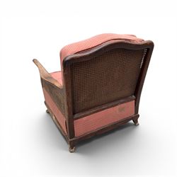 Early 20th century French style bergère conservatory suite, canework back and sides with red upholstered loose seat cushions, on cabriole feet
