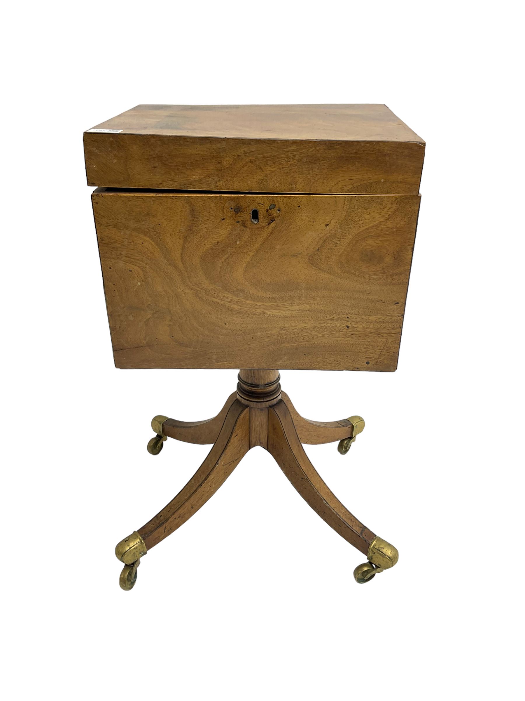 Regency mahogany cellarette on stand, rectangular top with hinged lid, raised on turned pedestal terminating in quadrupod base with brass cups and castors