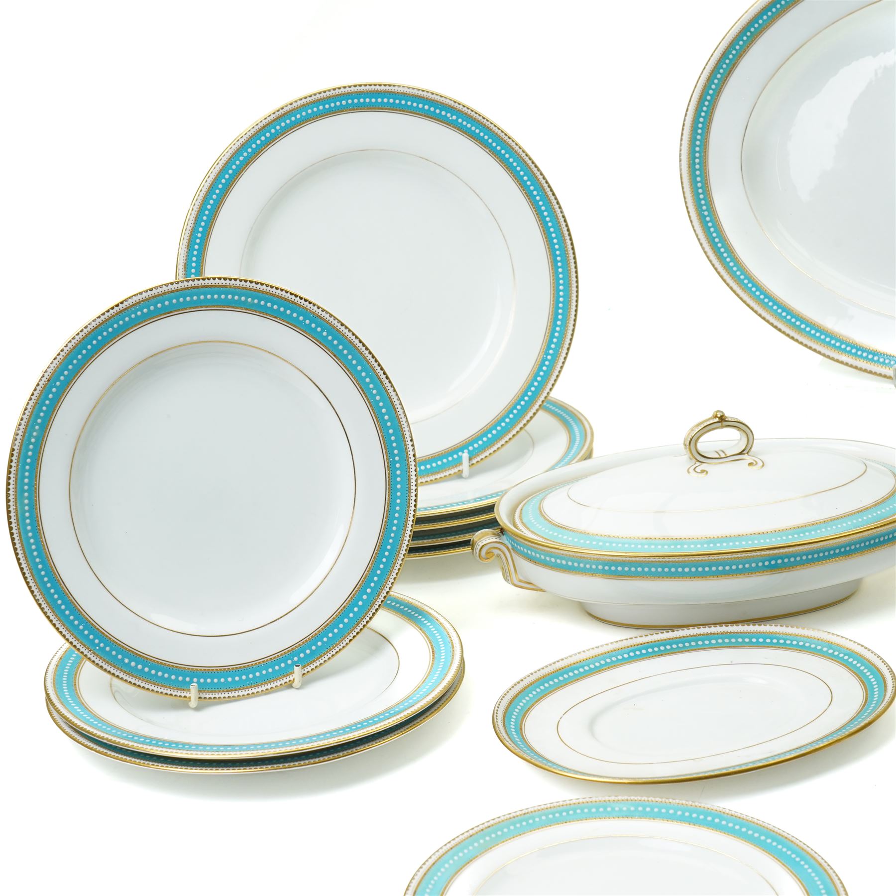 Spode Copeland's china part dinner service, circa 1900, with a blue and gilt jewelled border comprising ten dinner plates, seven dessert plates, two side plates, pair of vegetable dishes and covers, two sauce tureen stands and oval meat plate retailed by T Goode, London