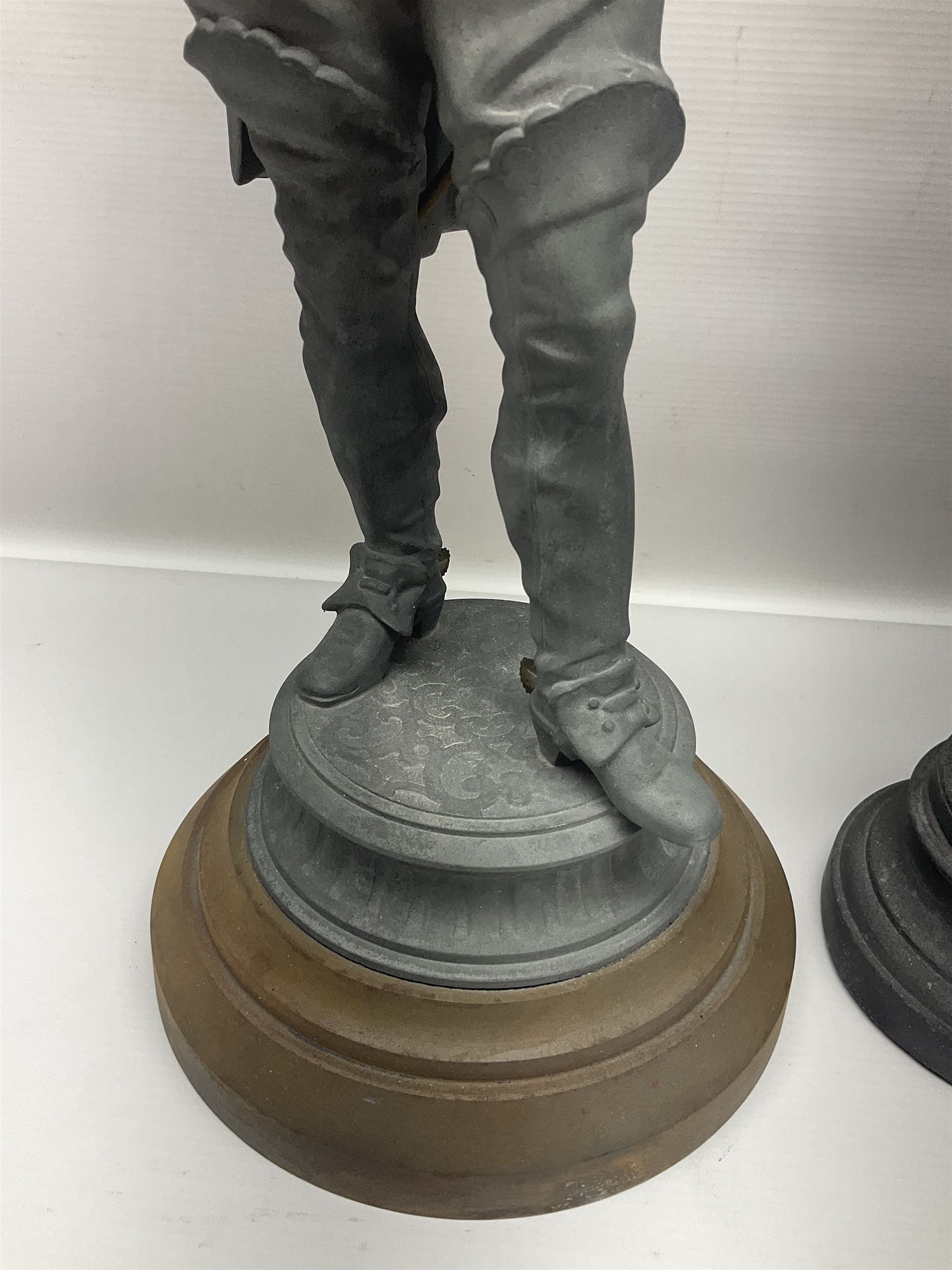 Pair of spelter figures modeled as Cavaliers, together with a spelter figure of Joan of Arc, largest H52cm