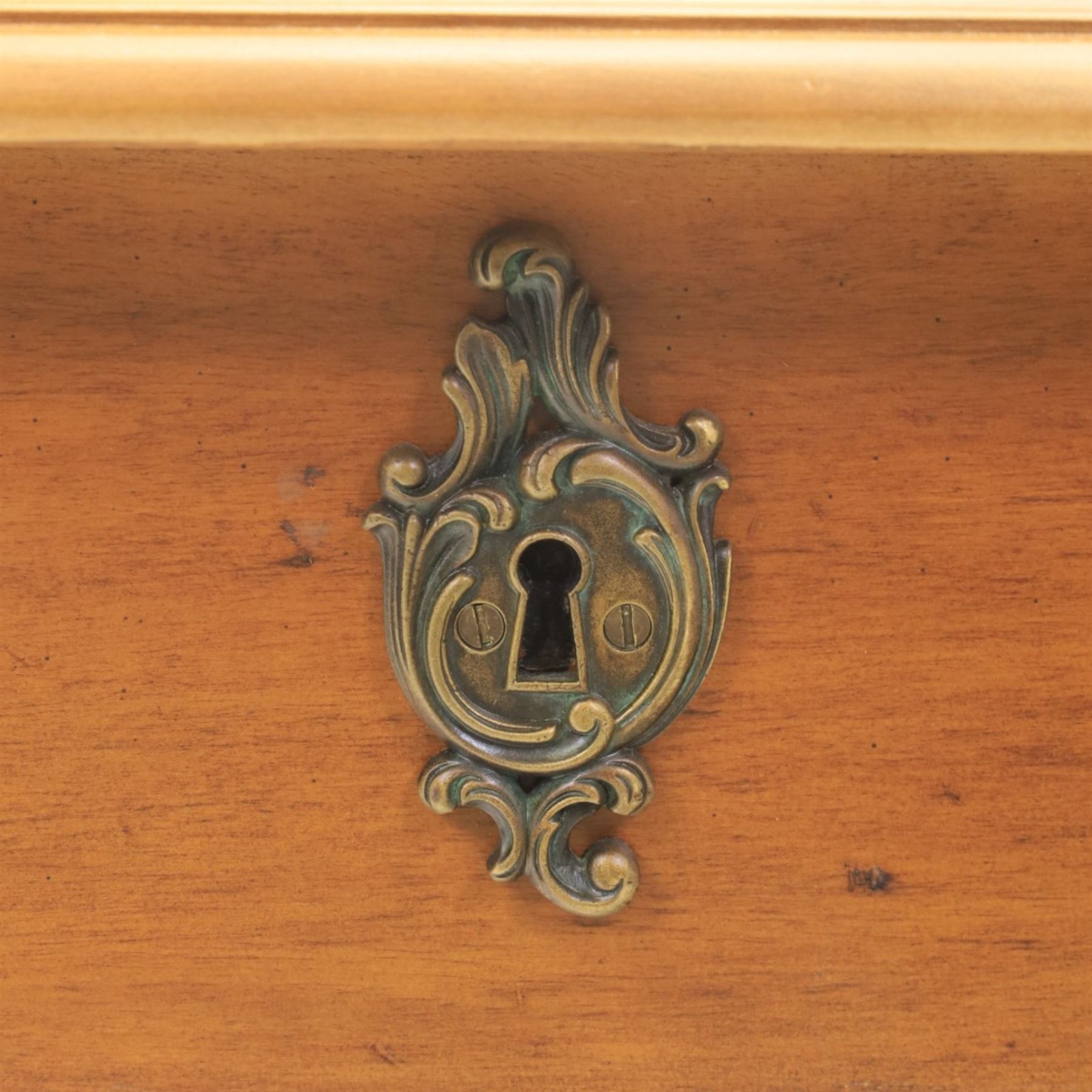 And So To Bed - Cherrywood serpentine dressing table, two drawers with brass handles foliate design with applied gilt mounts, raised on cabriole legs with gilt caps