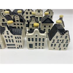 Twenty seven KLM Bols Blue Delft's decanters in the form of Dutch houses, some with contents