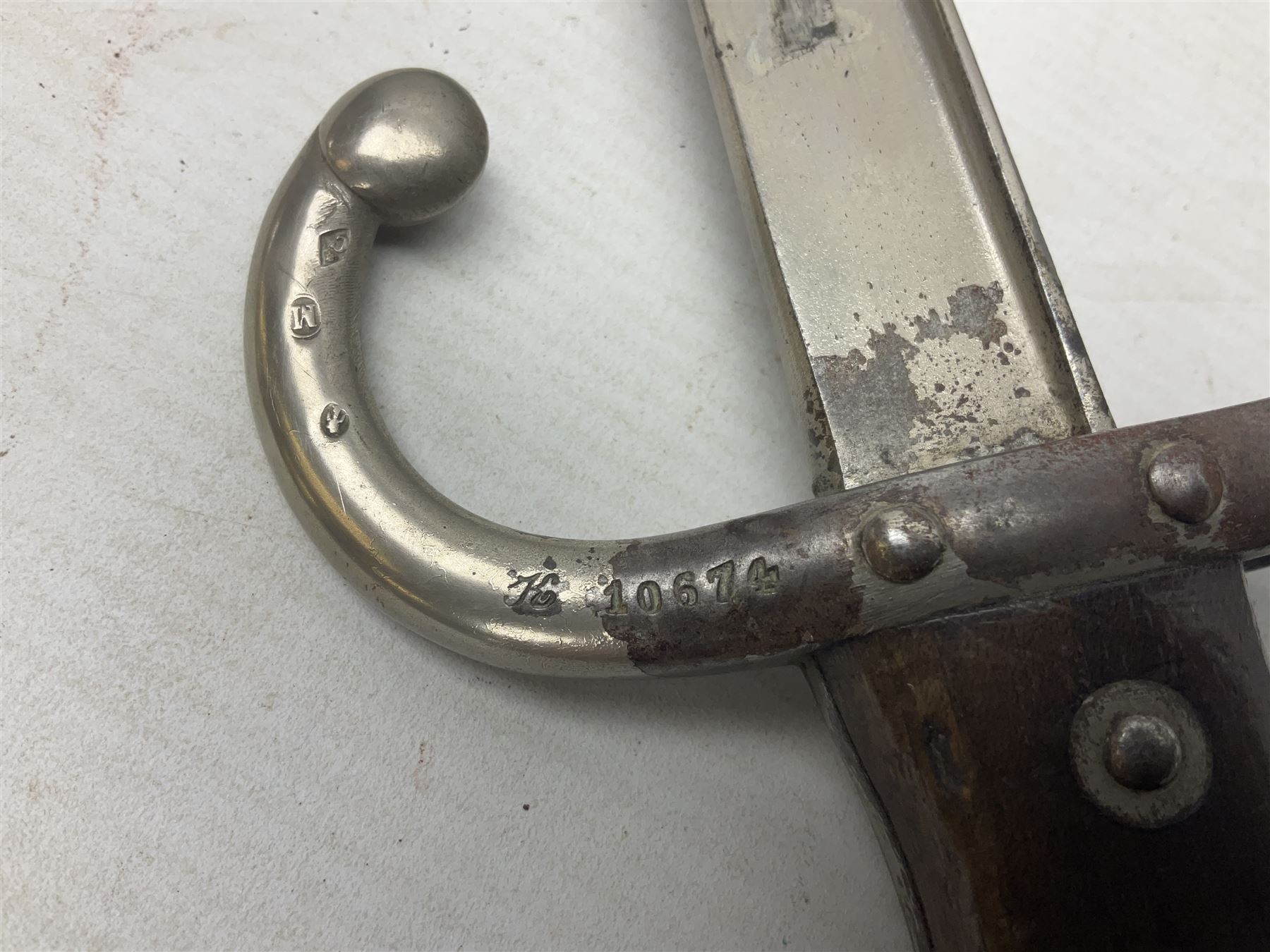 French Model 1866 Chassepot bayonet with 57cm curving fullered steel blade dated 1873 No.L63963; in steel scabbard with conforming number L71.5cm overall; and French St. Etienne Gras bayonet dated 1878 No.K10674 in steel scabbard numbered 79437 (2)