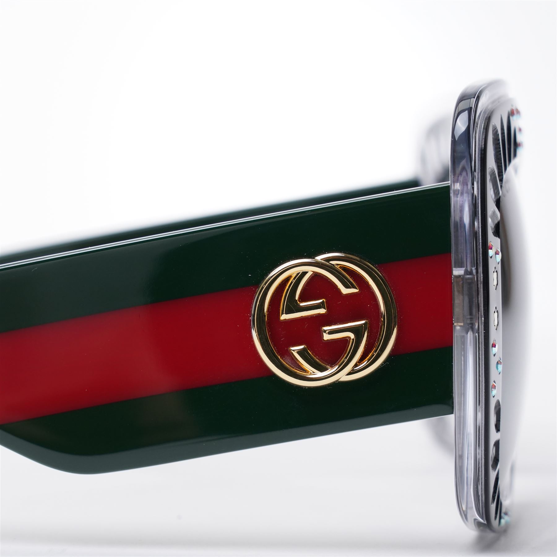 Gucci - pair of oversized black acetate sunglasses, the square frames with studded and crystal embellishment to the front and signature green and red web temples with interlocking gold-tone GG logo and bee motif, unused with original velvet pouch and box