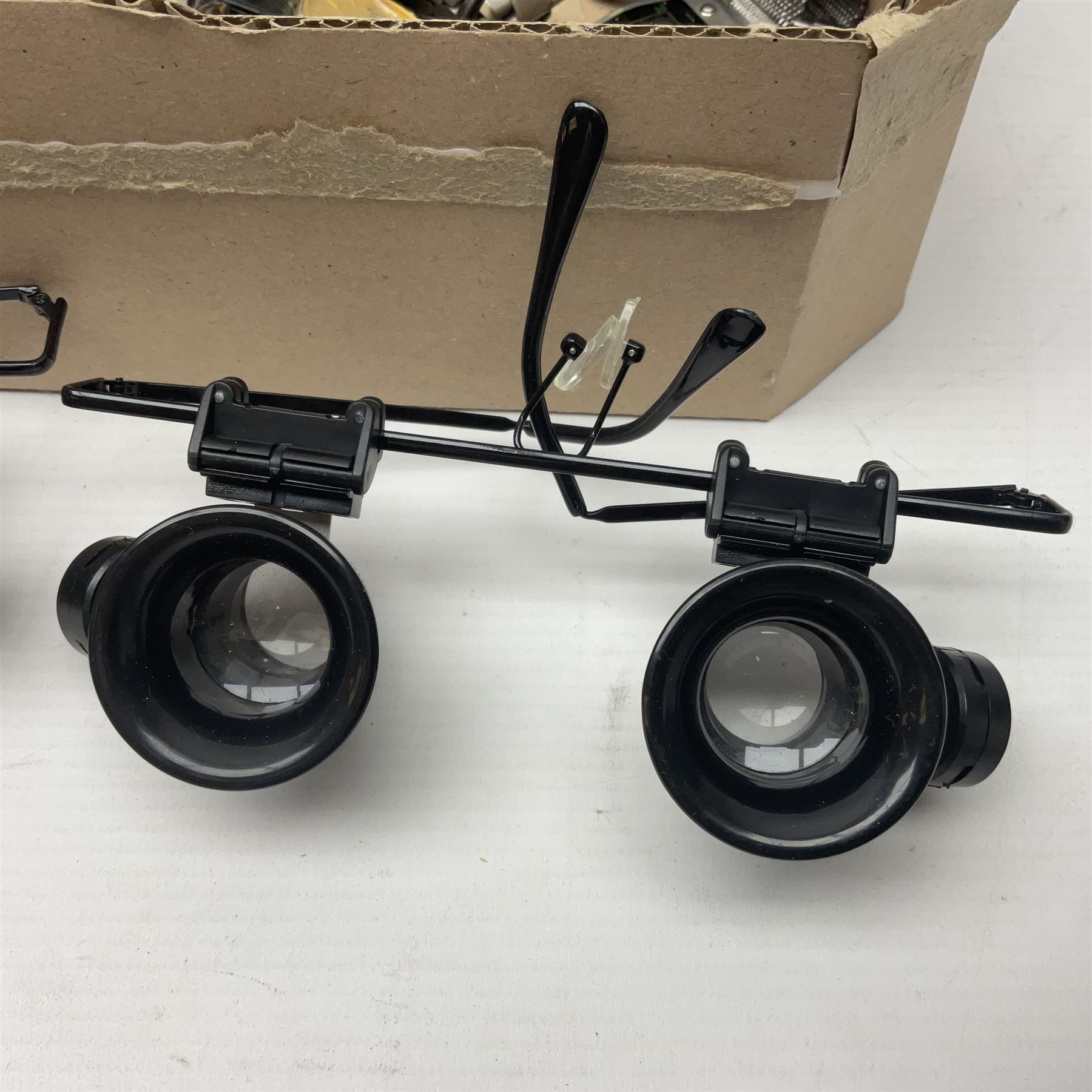 Collection of wristwatches, makers including Bulova and Ingersoll, and some watch makers equipment including glasses, vice and watch back opener