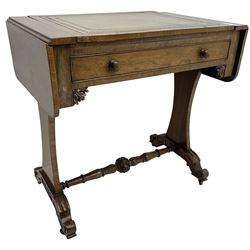 Regency rosewood writing table, rectangular drop-leaf top with rounded corners, hinged easel centre with inset leather writing surface, fitted with single cock-beaded drawer, foliage carved corner brackets, on waisted end supports with scroll carved out-splayed feet, central turned stretcher carved with acanthus leaves and flowerheads 