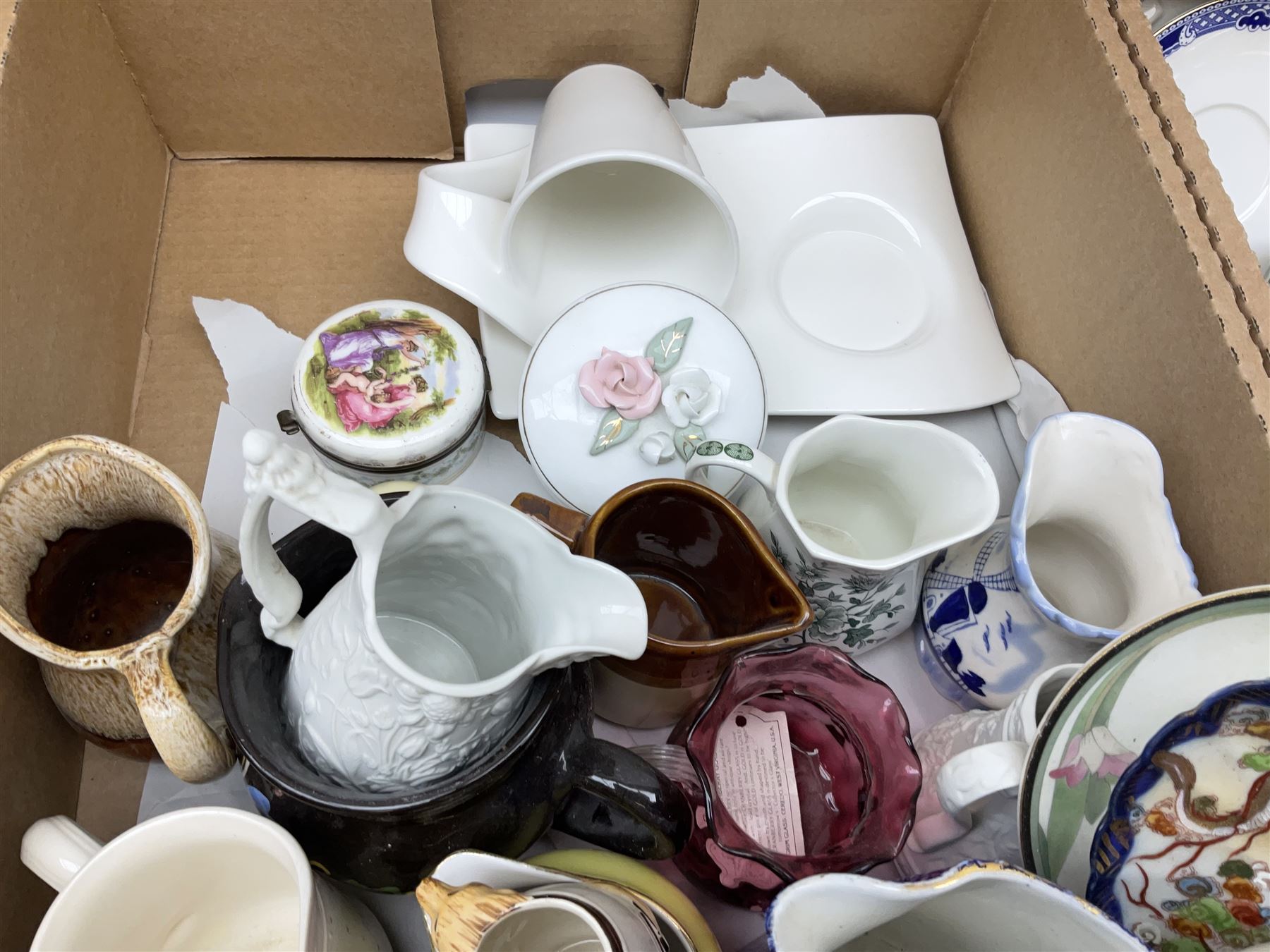Quantity of various ceramics and glassware to include pair of Disney Mickey and Minnie Mouse cowboy Sherriff figures, stamped Japan beneath, Mason's ironstone, Wedgwood, Portmeirion, tea and dinner wares, collectors plates, glass animals etc in four boxes