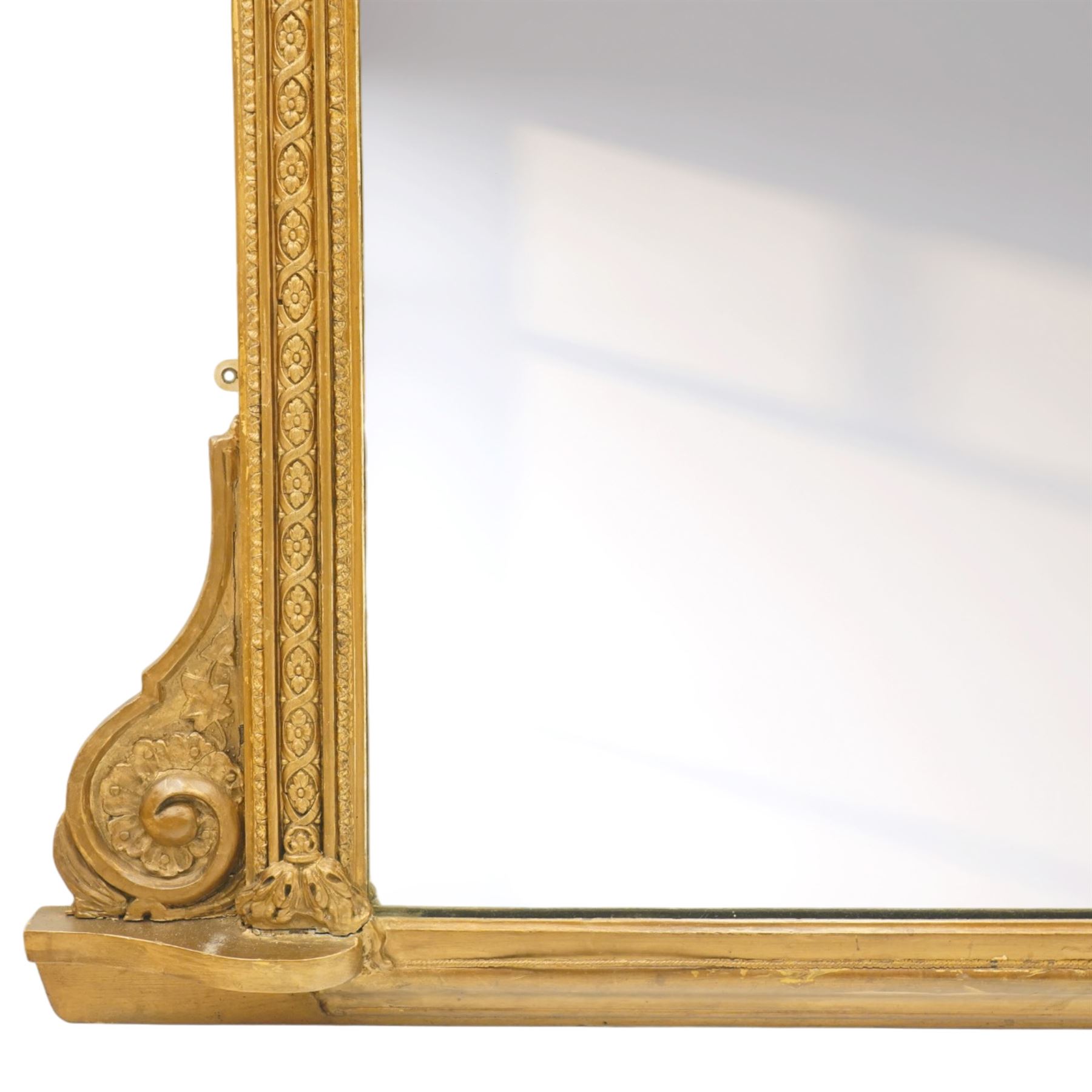 Large Victorian giltwood and gesso pier mirror, plain rectangular mirror plate enclosed by moulded frame with egg-and-dart cornice, foliate frieze and classical caryatid uprights, the lower corners decorated with scrolling acanthus, on shaped plinth base
