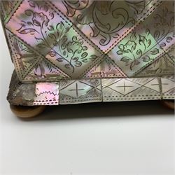 Victorian mother of pearl tea caddy, of rectangular bow-fronted form, the body with floral, bird and geometric engraved mother of pearl panels, white metal shield plaque to the cover inscribed with the initials G.J.A and similar escutcheon, the two division interior with ivory edging and two panelled mother of pearl lids, on four vegetable ivory bun feet L20cm, together with a similar style mother of pearl card case (2) This item has been registered for sale under Section 10 of the APHA Ivory Act