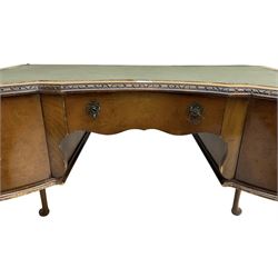 Early 20th century Queen Anne design walnut writing desk, reverse bow-front with inset green leather writing surface and foliate carved edge, fitted with three drawers, raised on cabriole supports