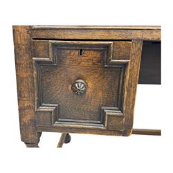 Early 20th century Jacobean design oak desk, with rectangular top inset with worn tooled leather, two frieze drawers over pedestals each fitted with a pair of panelled drawers, turned handles, on carved and fluted tapering legs united by stretchers 