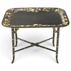 Victorian ebonised and gilt-painted papier-mâché tray on later ebonised and parcel-gilt si...