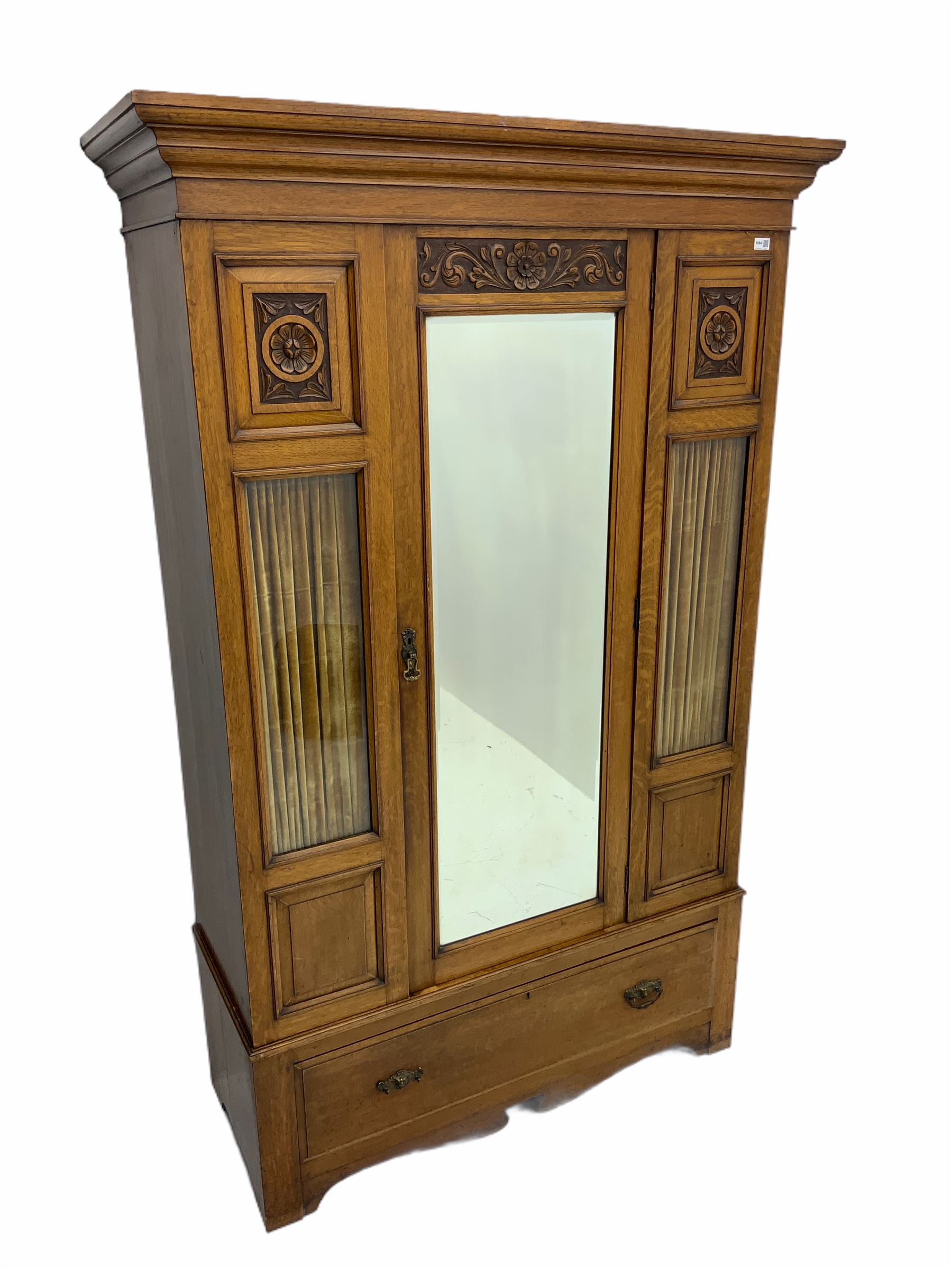 Edwardian oak wardrobe, single mirror door, glazed panels with decorative curtains behind, single drawer to base