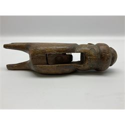 Rare primitive treen lever action nutcracker, probably late 17th/early 18th century, carved in the form of a man, with old collector label to side inscribed 'A Nutcracker XVI Century', H18cm