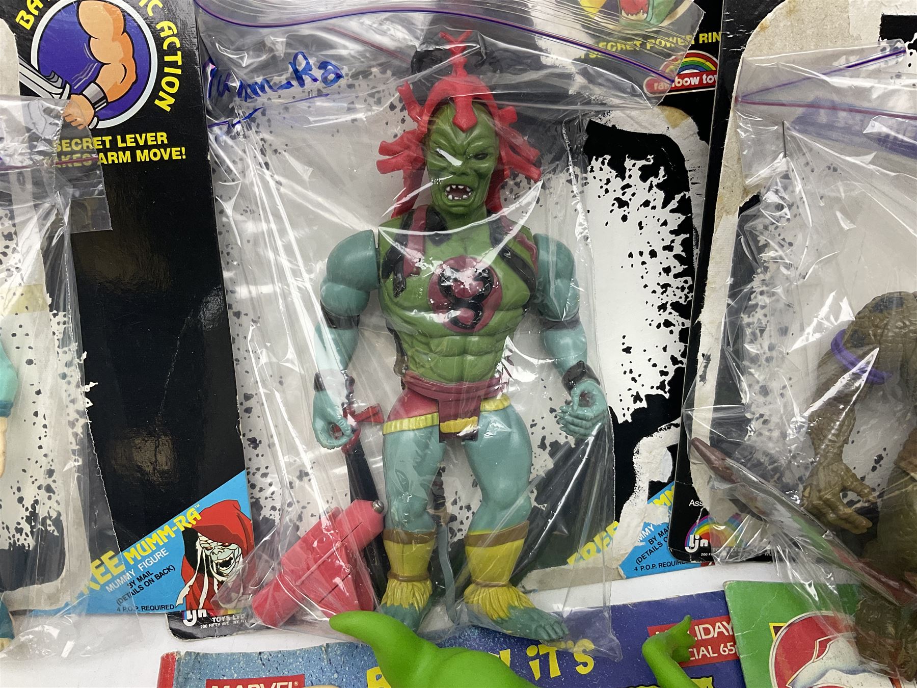 Five 1980s LJN Thundercats figures - Lion-O with sword, Snowman, S-S-Slythe, Tygra and Mumm-Ra; all re-bagged on original backing cards; partially stocked Panini sticker album; story cassette tape and three catalogues; together with Ghostbusters Slimer with food and Comic