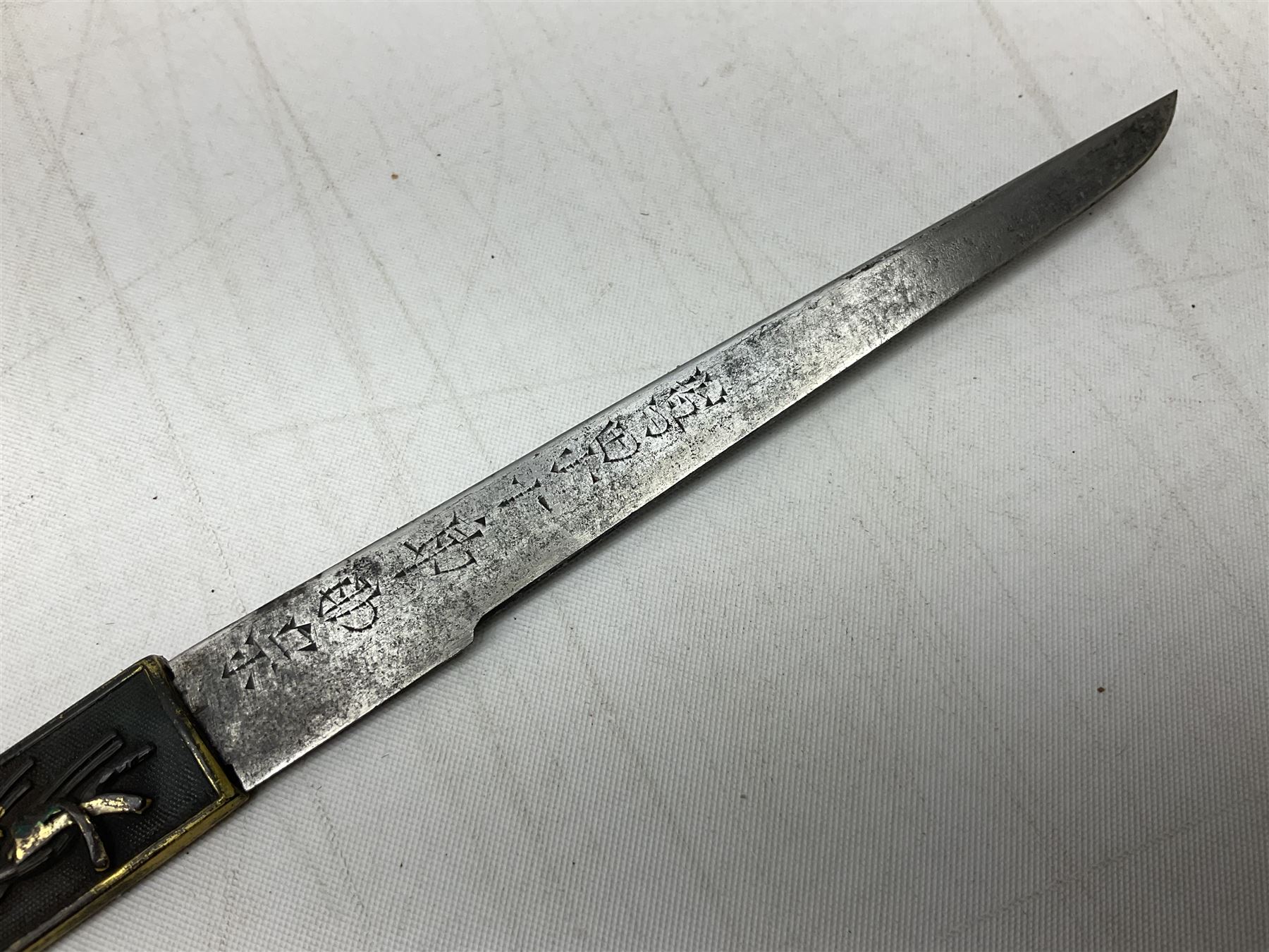 Japanese Tanto with 28.5cm steel blade and cord bound grip; in red spotted black lacquer saya containing a kogai knife with etched characters to the blade and ornate fern leaf and snake handle