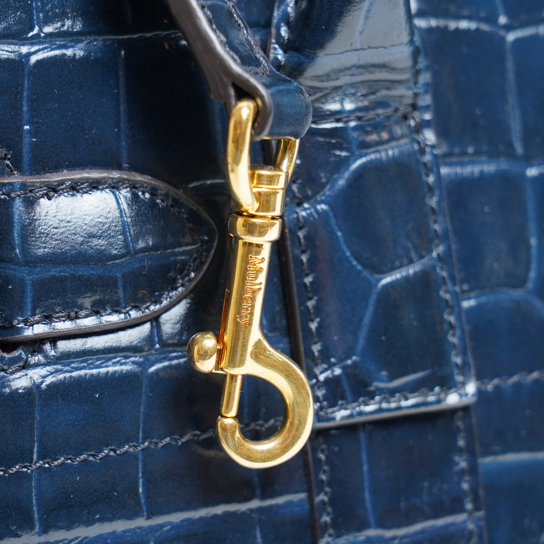 Mulberry - Belted Bayswater with Zip handbag in Midnight Croc embossed leather, the structured body with twin rolled top handles, detachable and adjustable shoulder strap, gold-tone Postman’s Lock fastening, belted front detail and zip closure, burgundy suede interior, with original dust bag
