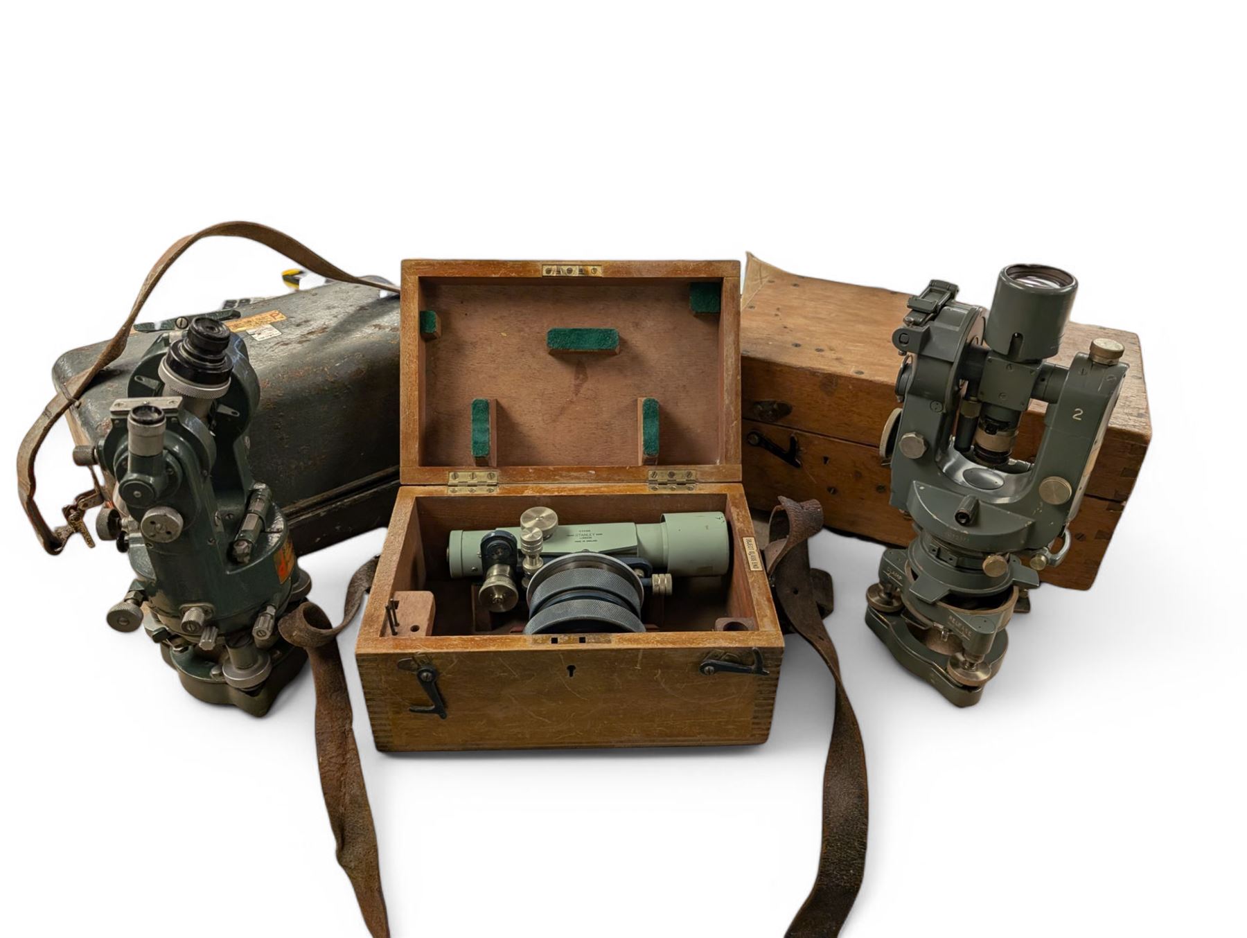 Two theodolites, comprising a Watts example in fitted hard case and a Cooke Troughton and Simms examplie in a wooden case, together with a Stanley dumpy level and a Hall and Watts surveyors measure