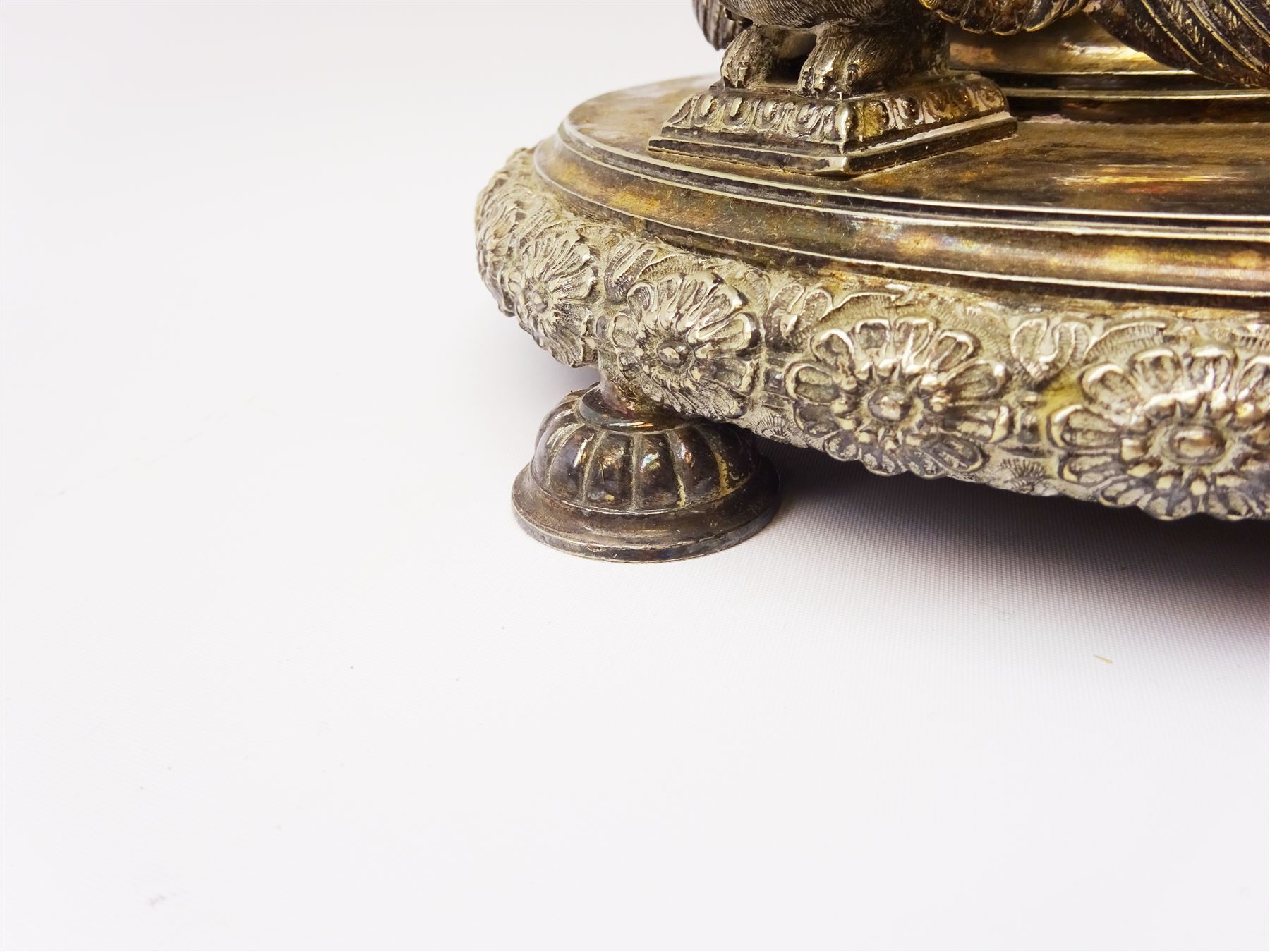 A large Victorian Thomas Bradbury & Sons silver plated candelabrum, the circular base with flower head border upon three domed feet, supporting a central knopped and fluted column flanked by three zoomorphic creatures, leading to a central socket with removable nozzle above a large palmette detailed drip pan, and three scrolling branches with conforming sockets and nozzles, with maker's silver plate mark and Victorian registration lozenge beneath, H62.5cm