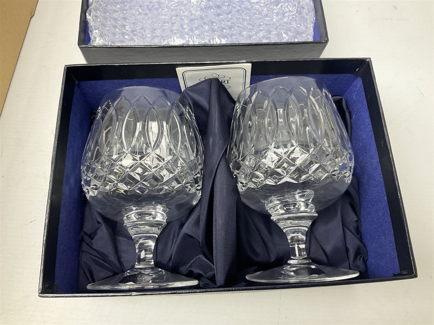 Boxed set of Banda carpet bowls, two boxed sets of Stuart glasses, Murano art glass bowl, cloisonné plate decorated with flowers upon gilt ground, silver plate and other metalware etc