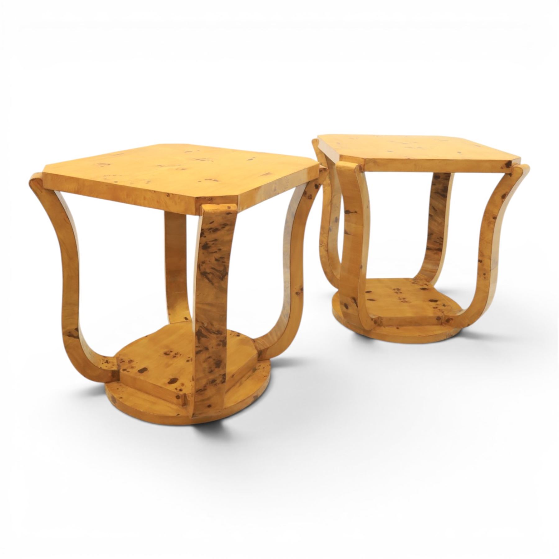Art Deco style pair of burr walnut lamp tables, octagonal top with rounded corners and book-matched veneers, on four shaped supports united by a circular undertier and plinth base