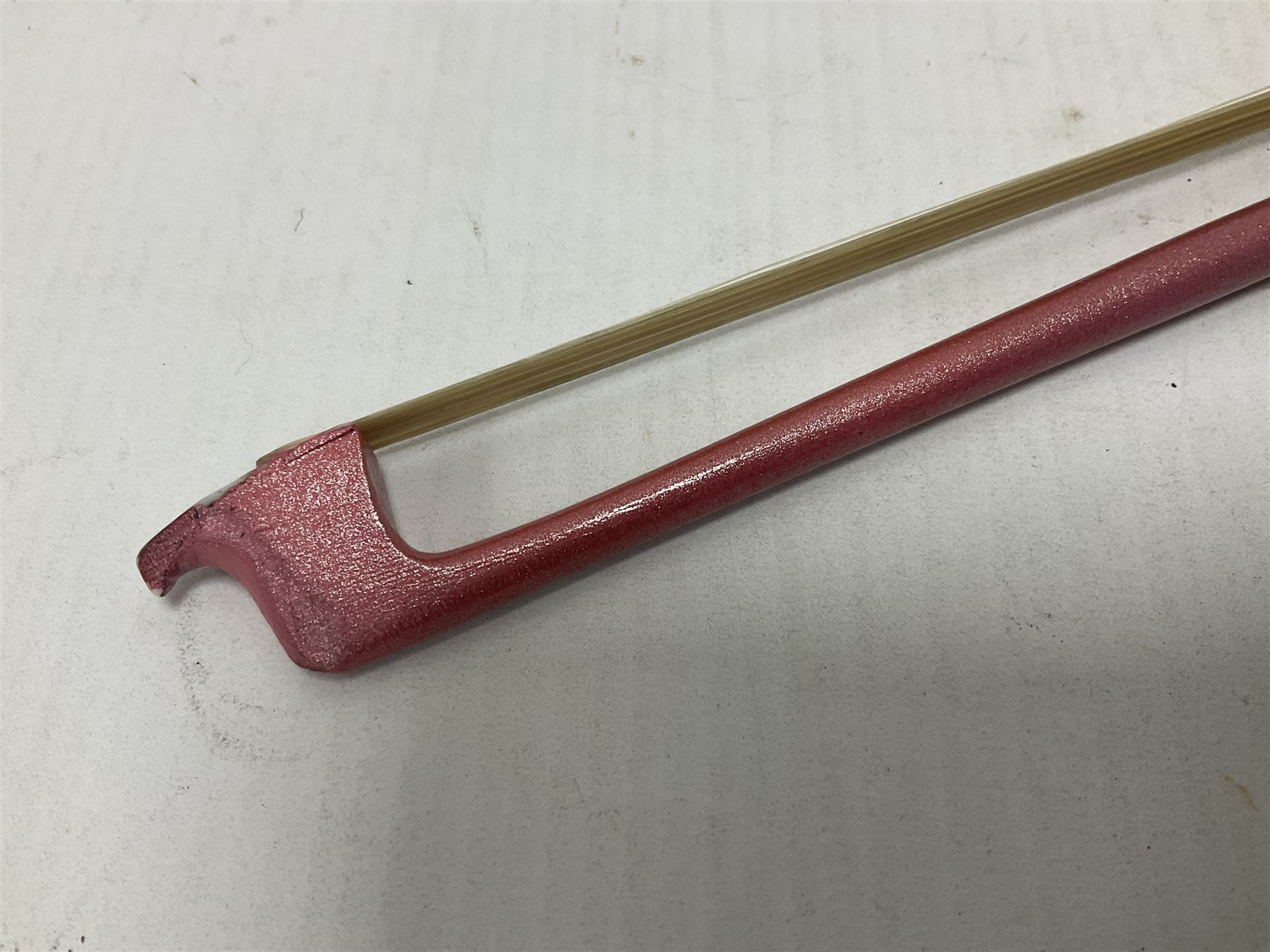 Zest full size pink violin, with a solid wood body and maple head, with matching pink bow and two further bows, in a hard case Length 60cm