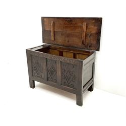 Early 18th century oak coffer, single hinged lid, triple panelled front carved with lozenges, stile supports