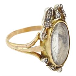 19th century gold and silver diamond portrait ring, set with an oval miniature of a woman on ivory, under a glazed panel, with rose cut diamond bow and floral sprigs below, to trifuricated shoulders. This lot has been registered for sale under Section 10 of the APHA Ivory Act