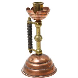 Pair of Arts and Crafts brass and copper candlesticks after a design by Dr Christopher Dresser with bobbin turned hardwood handles on domed weighted bases Rd No.5379 H19cm