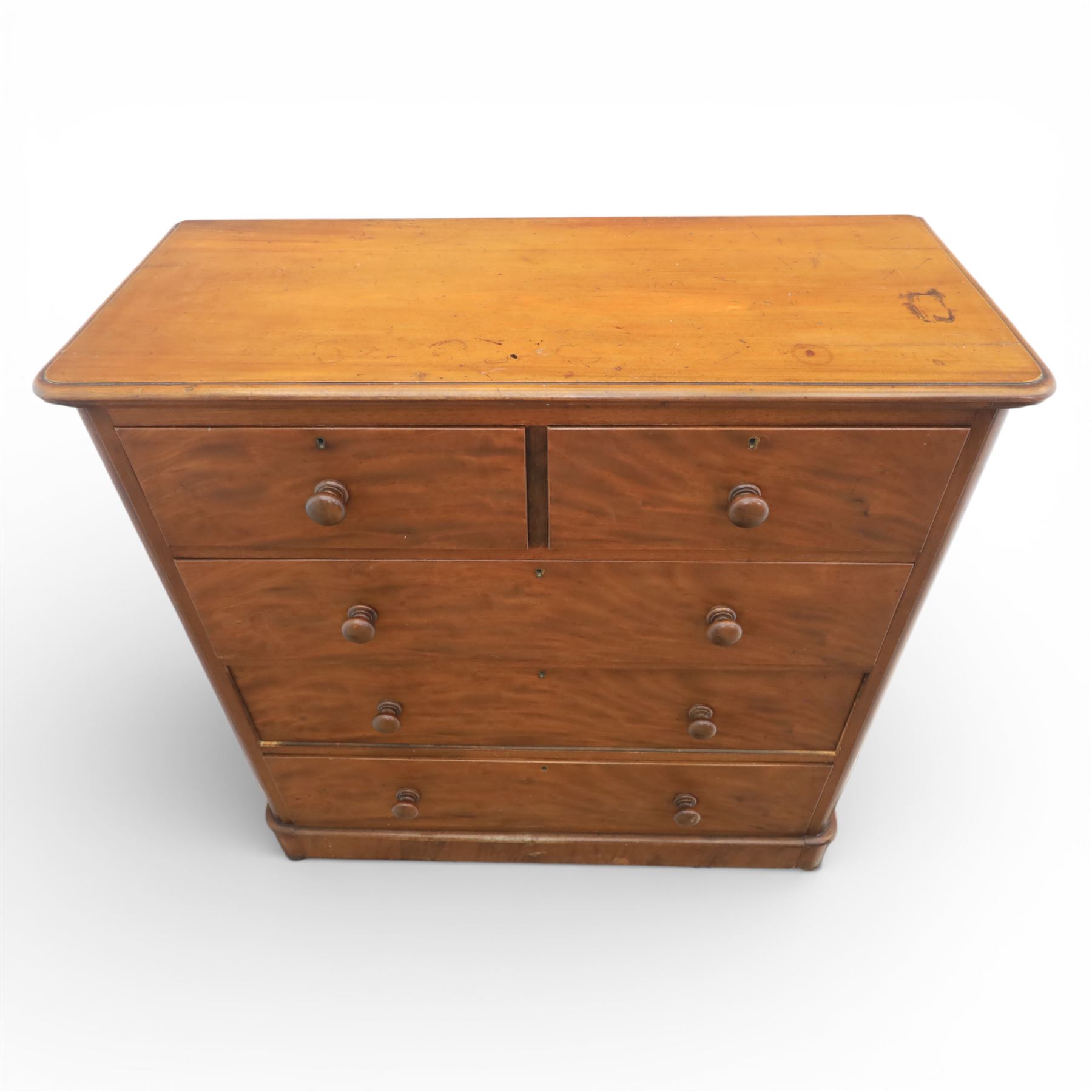 Mid Victorian flame mahogany chest of drawers, the moulded bow front top over two short and three long graduated drawers, fitted with turned wooden knob handles, flanked by rounded front corners continuing to plain sides, raised on a plinth base