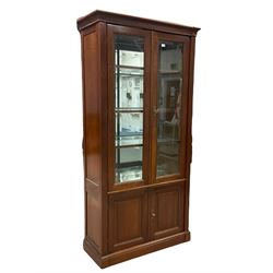 Grange Furniture - cherry wood finish display cabinet, two bevel glazed doors enclosing mirrored interior with glass shelves, double panelled cupboard below, on plinth base