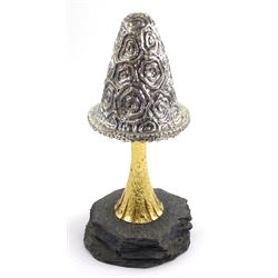 Christopher Nigel Lawrence limited edition silver and parcel gilt surprise mushroom, the textured domed cover opening to reveal two elves carolling beneath a lantern and before a fire pit set with semi-precious stones, upon a slate base, no 24/250, hallmarked Christopher Nigel Lawrence, London 1982, overall H9cm