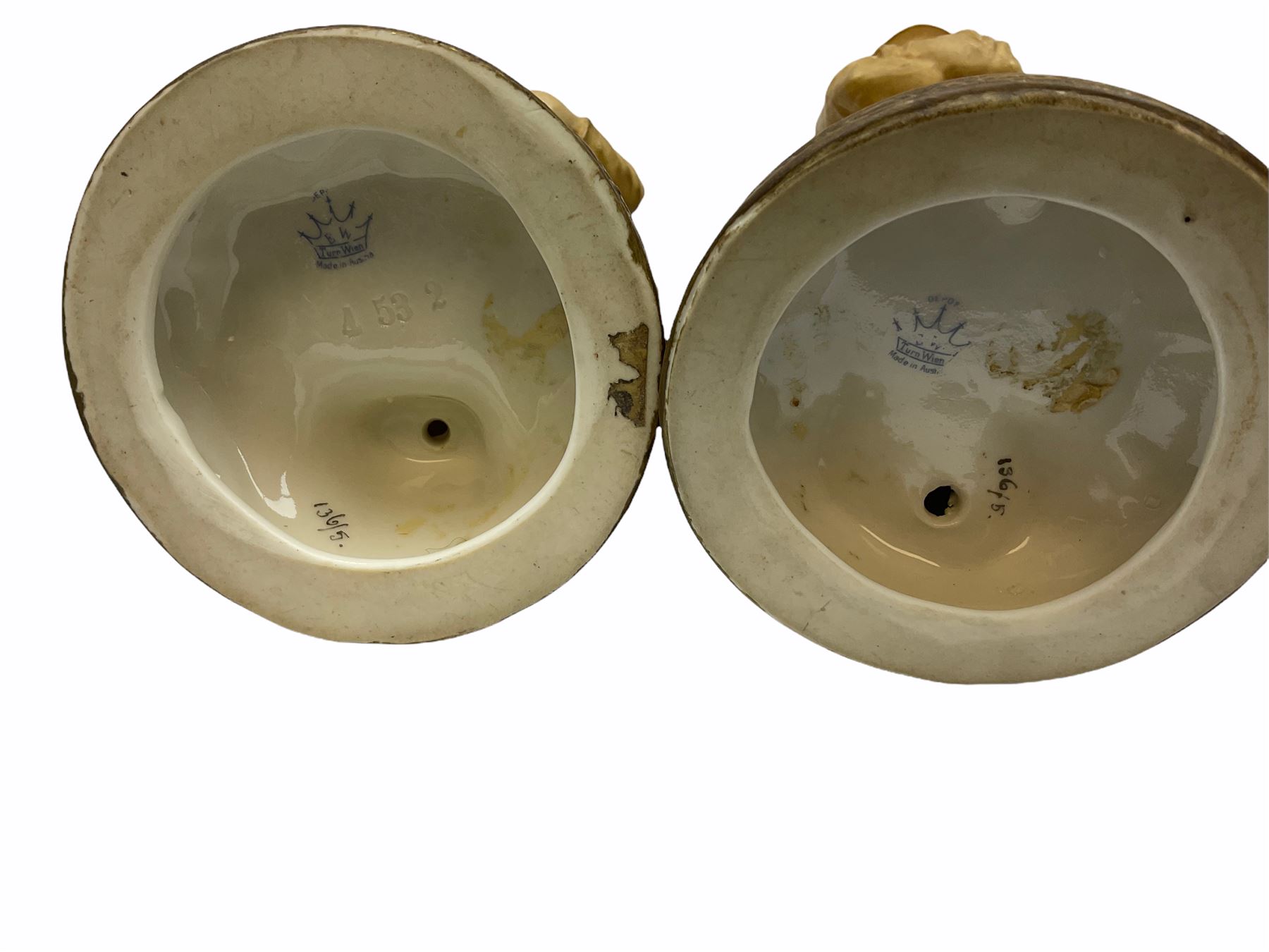 Royal Dux figure modelled as a fish seller, with applied triangle mark to the base and impressed model number 2292, H27cm, together with three Royal Dux style elephants, and a pair of Austrian Turn Wien figures, each carrying 'striker' baskets for matches. 